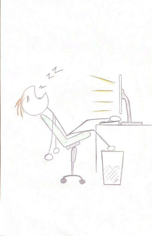 Person sitting on his chair while being very sleepy while the computer is right in front of him.